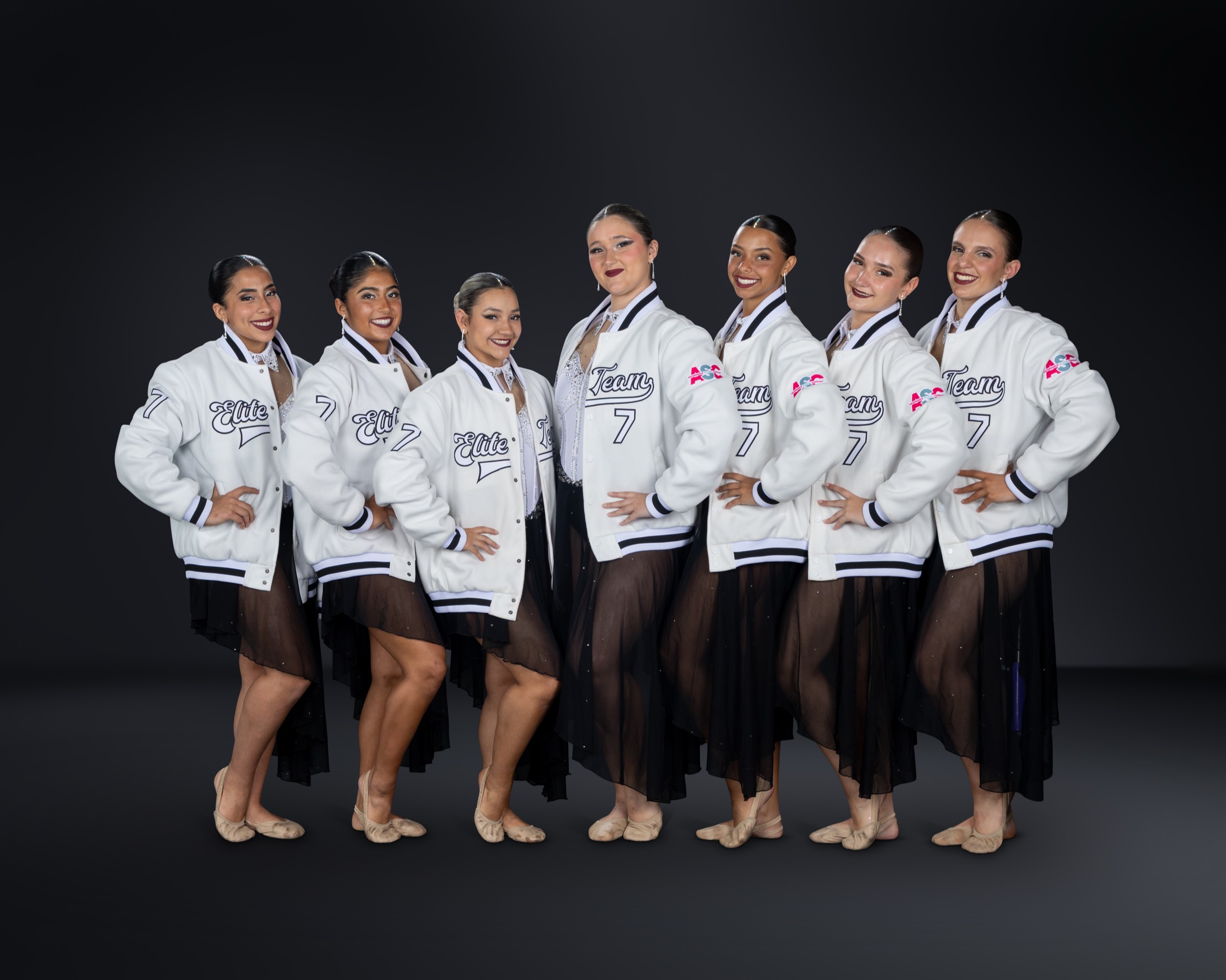 The Elite team together in their ASC varsity jackets