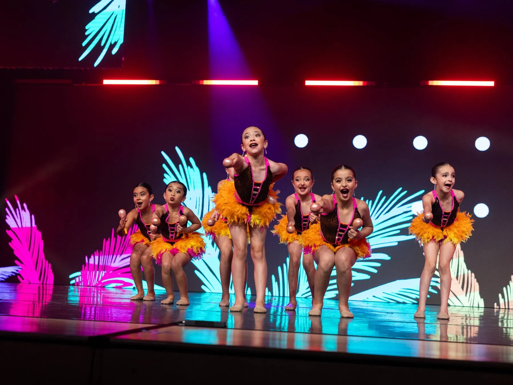 The maraca number lined up at the lip of the stage, every face turned out